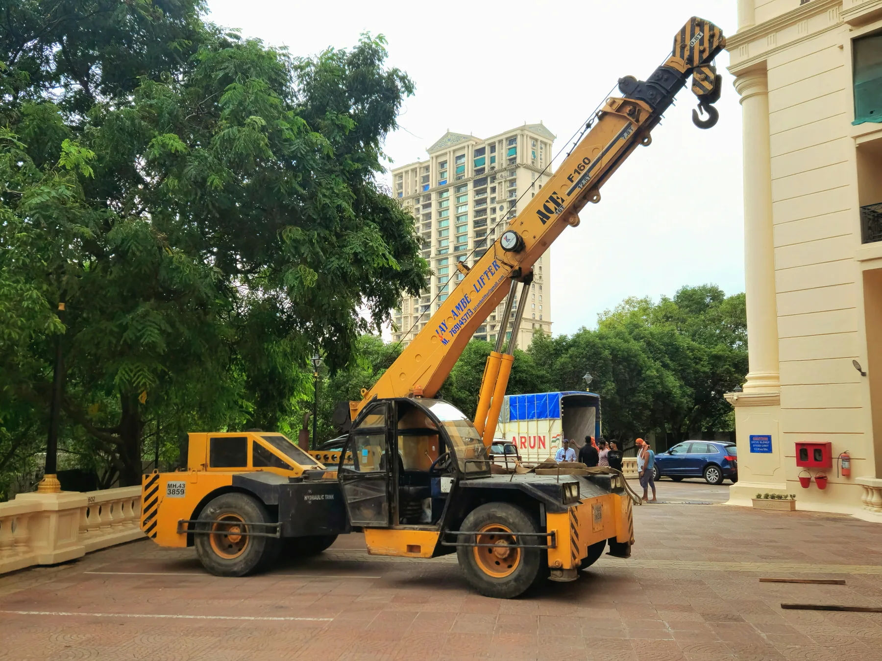 Mobile crane near a building